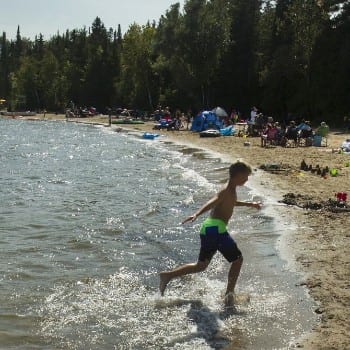 boy runing on kaawartha beach